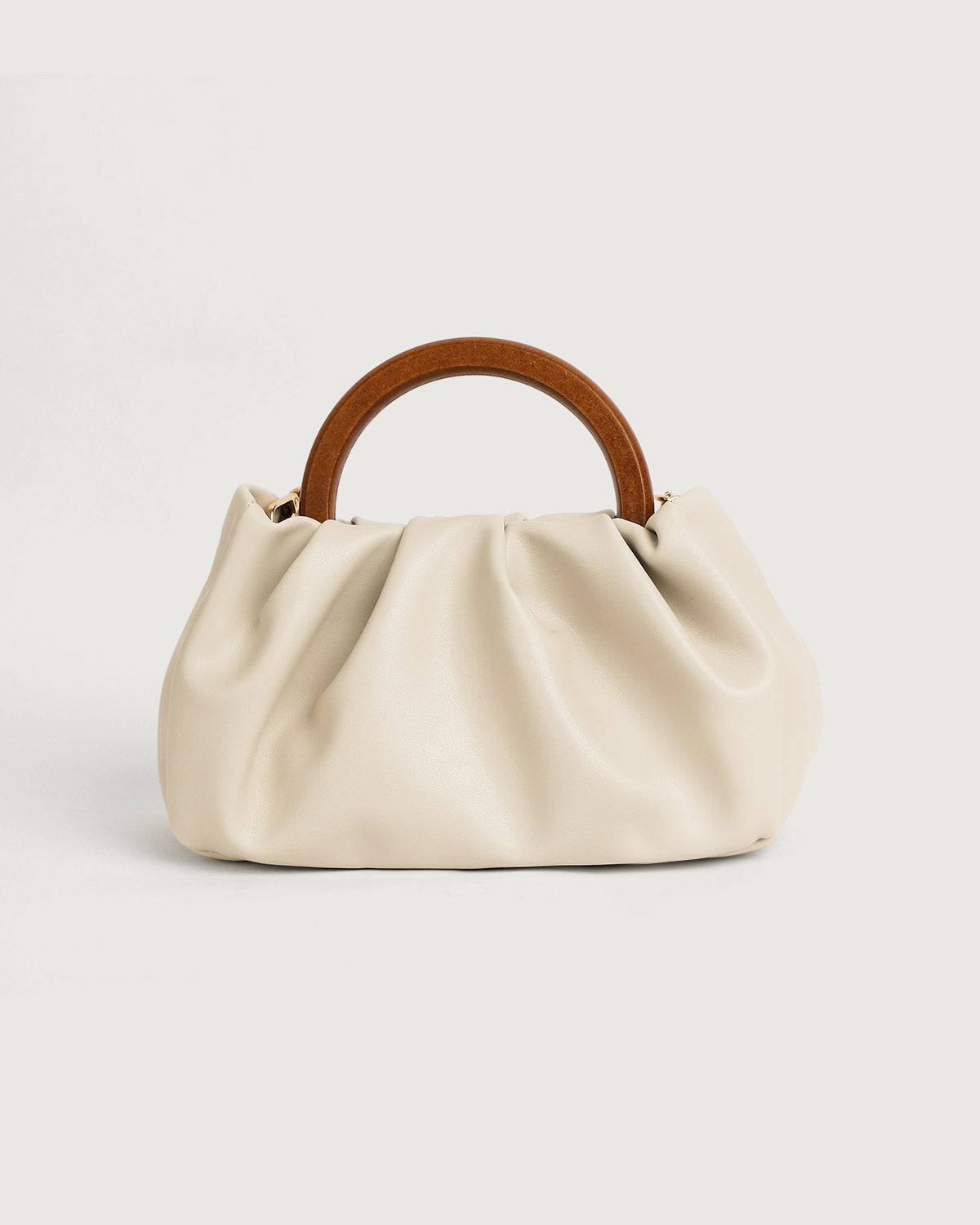 Sac à main plissé avec poignée en bois